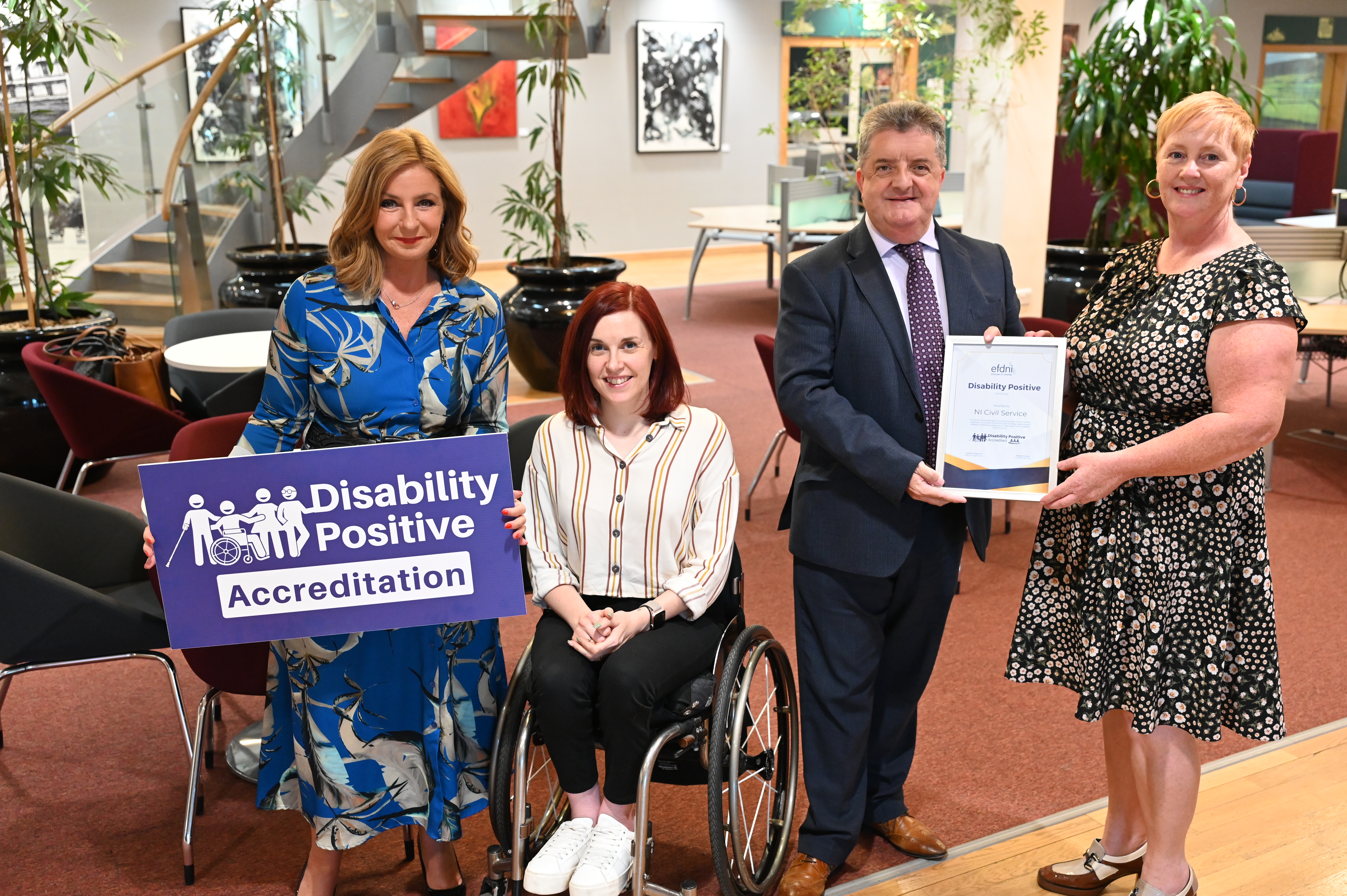 Photograph of Civil Service colleagues receiving the Disability Positive accreditation
